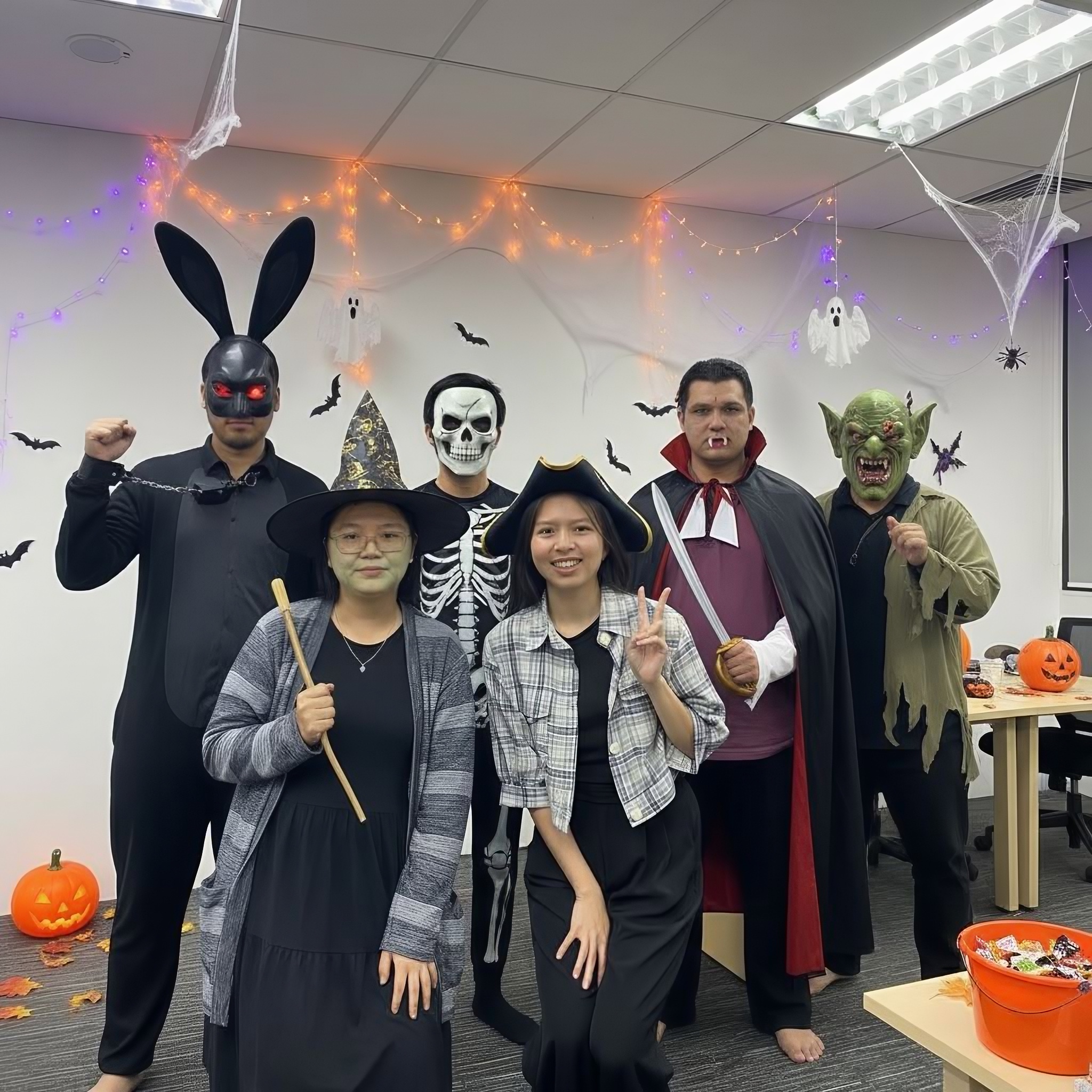 The team in Halloween costumes at the office